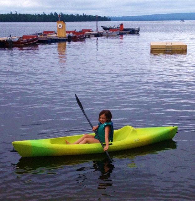Girl kayaking at Rideout's on East Grand Lake
