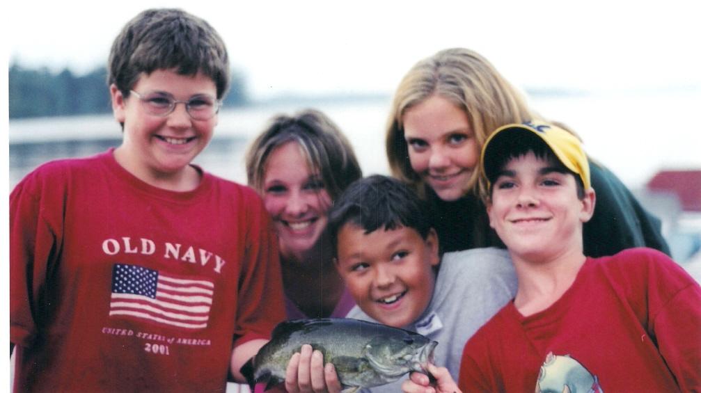 kids posing on dock